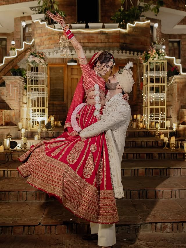 Bride and groom celebrating joyfully at their wedding