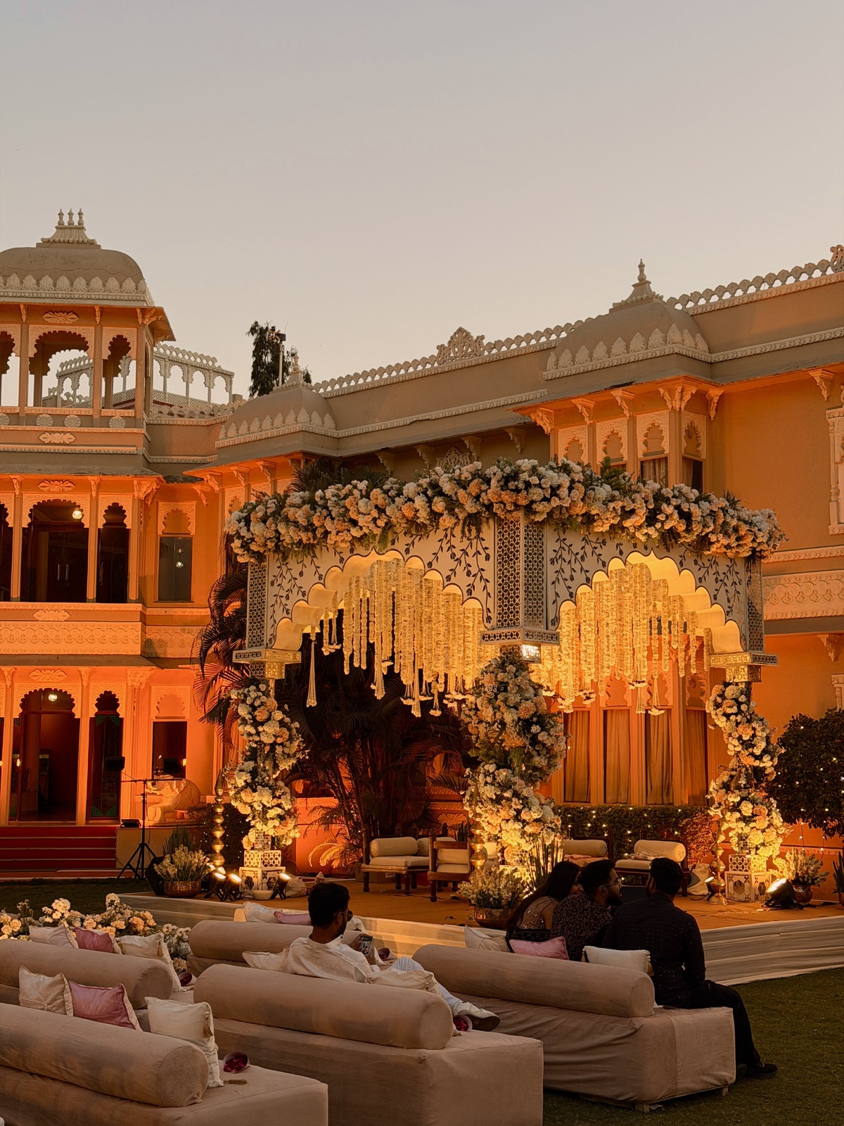 Illuminated palace venue at dusk